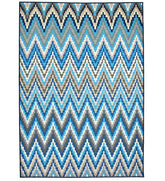 Blue pixelated chevron pattern rug for modern interiors.